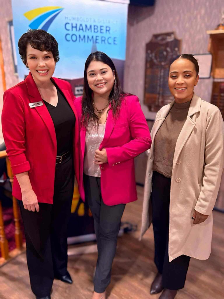 Executive director with other chamber members at a lunch and greet