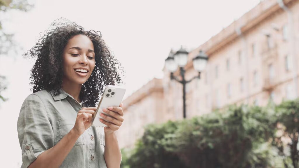 Woman enjoying Chamber Perks Mobile App for her business